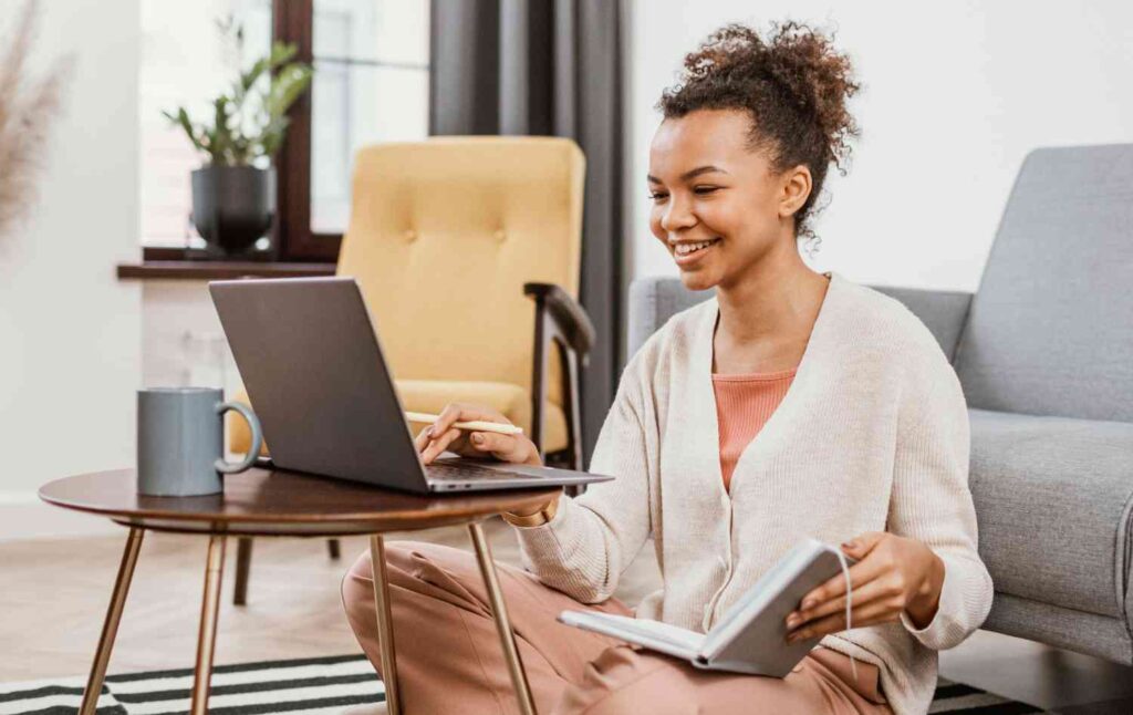 Happy woman working on her laptop.