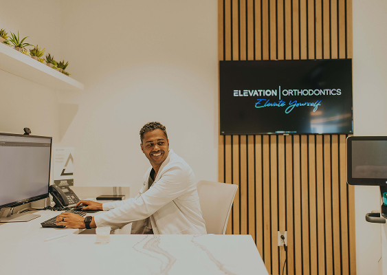 Dr. Brice reviewing digital orthodontic technology at Elevation Orthodontics in Nashville, TN